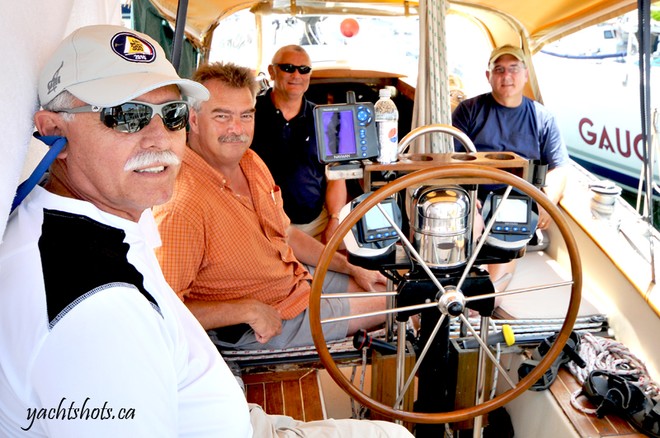 John Berry (second from left) relaxes in the cockpit of his classic Hughes 38 (1976), Moonlight Mistress July 16, 2010. Berry, Commodore of Newcastle Yacht Club, is among 187 competitors in this year’s Lake Ontario 300. SAIL-WORLD.com/Jeff Chalmers (PORT CREDIT, Ont) - Lake Ontario 300 -  Jeff Chalmers © Jeff Chalmers